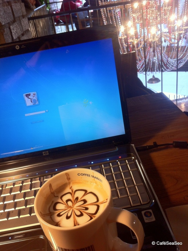My drink and my laptop at Coffee Market